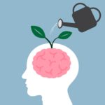 Watering can pouring water onto a head and the brain is sprouting new, green leaves